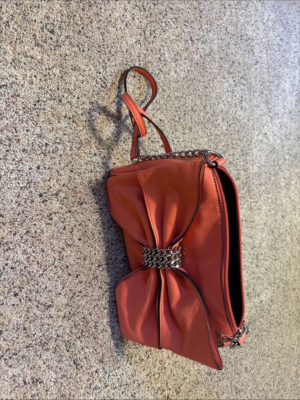 Elle Coral-Orange Bow Wristlet with Chain Accent